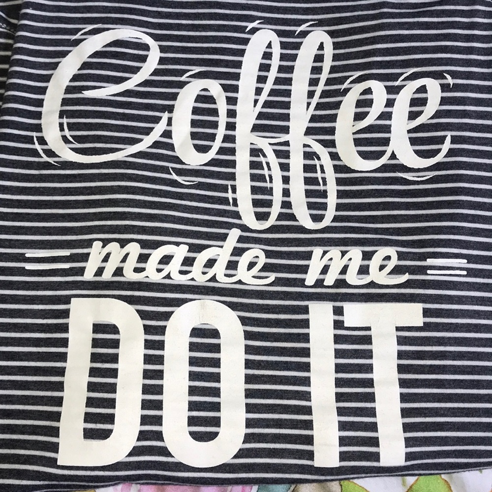 A striped blouse with a saying